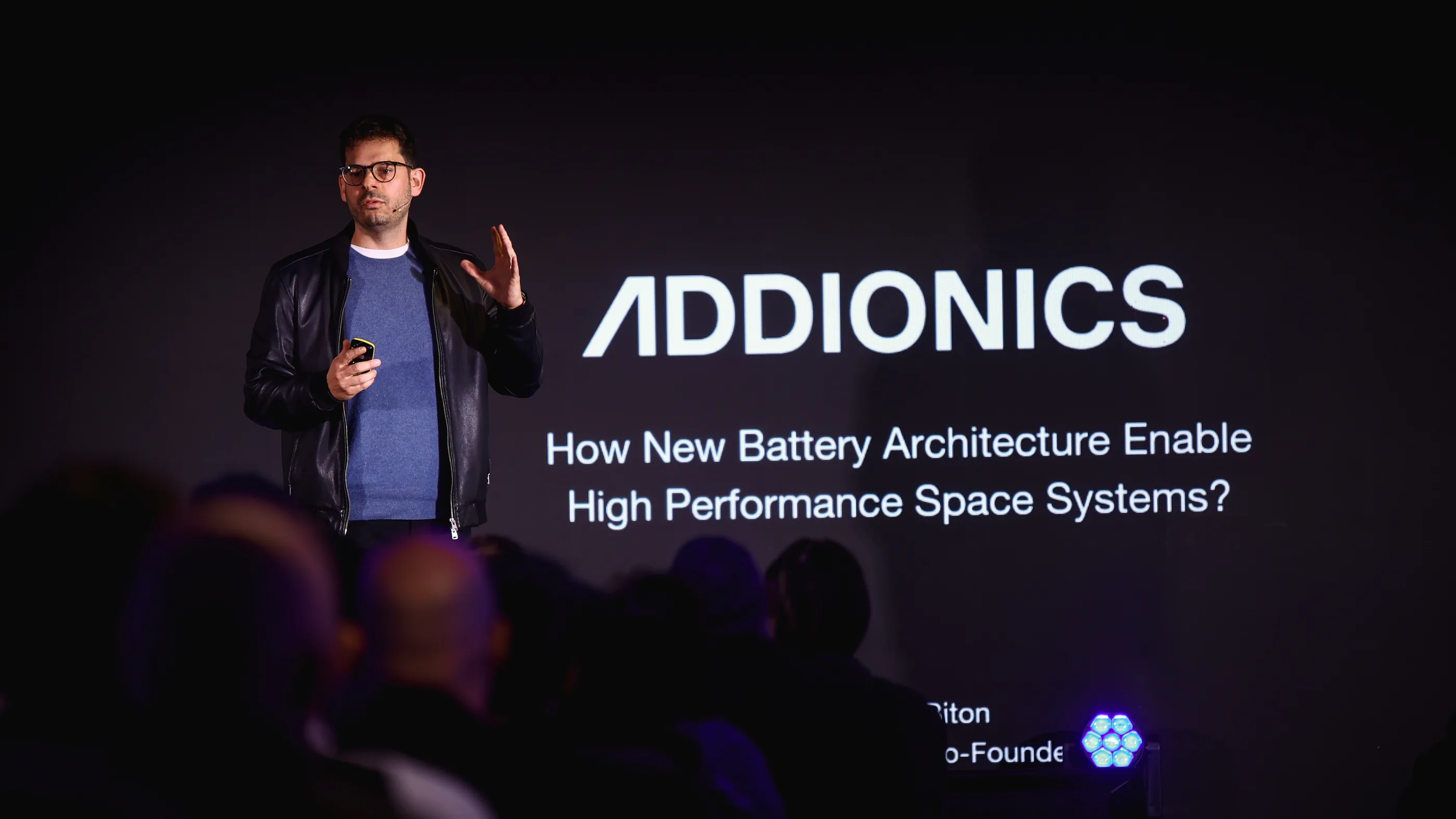 An Addionics founder presenting the company's battery architecture to a conference audience