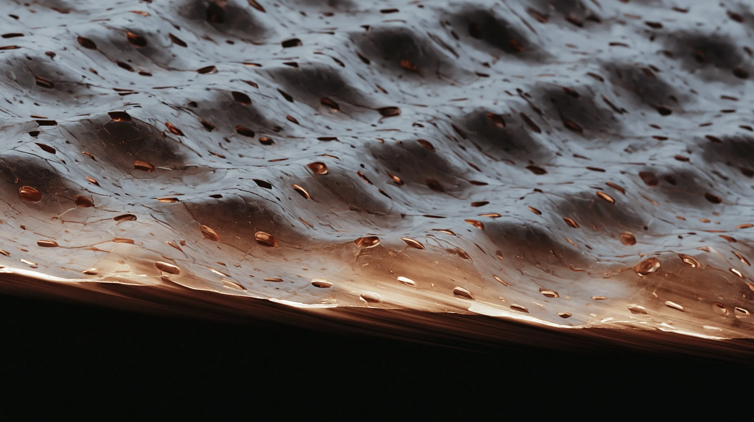 Color halftone render of a Smart 3D Current Collector: a porous metal sheet with copper-lined perforations resolved into a dot grid, edge-lit against black